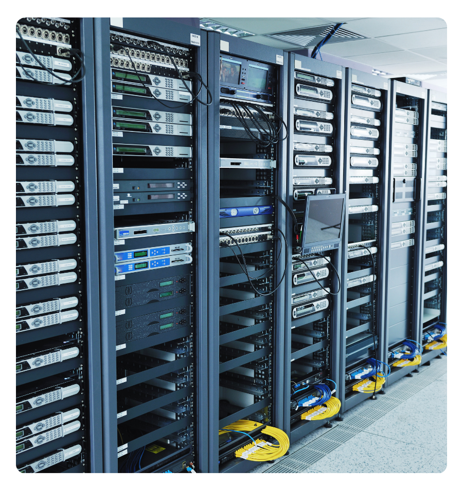 A server room with a row of racks that are holding servers an other IT equipment.