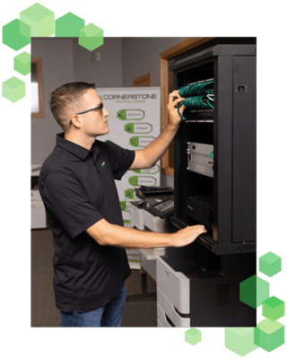 Jacob working on a server at Cornerstone Technologies.