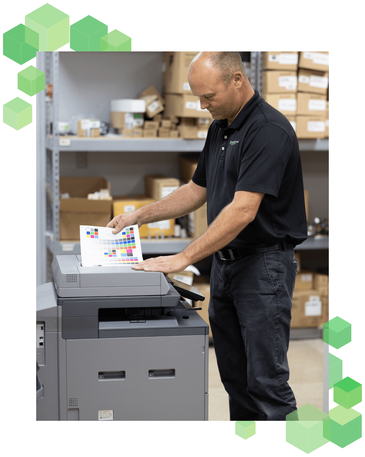 A Cornerstone Technologies' employee using a multifunctional printer to copy and scan.